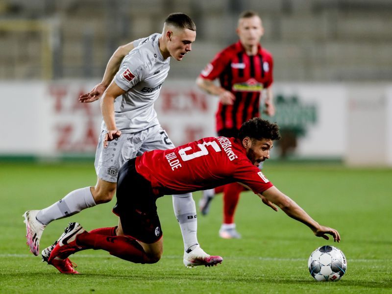 Florian Wirtz (left) becomes the youngest goal-scorer in Bundesliga history.