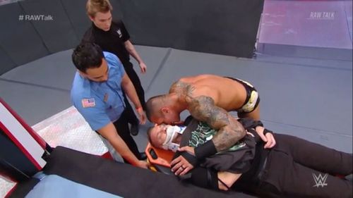 Orton whispers something in Christian's air