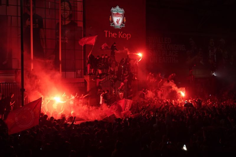 Liverpool fans gather around Anfield to celebrate their historic league title