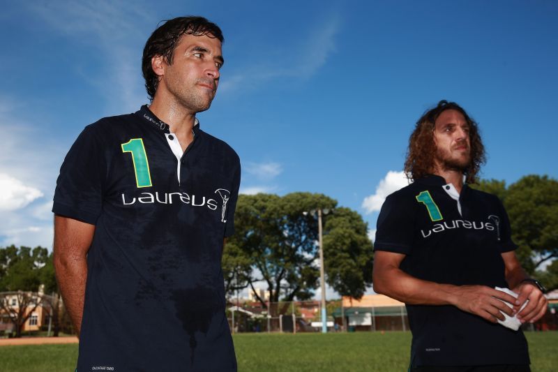 Real Madrid legend Raul with Carles Puyol