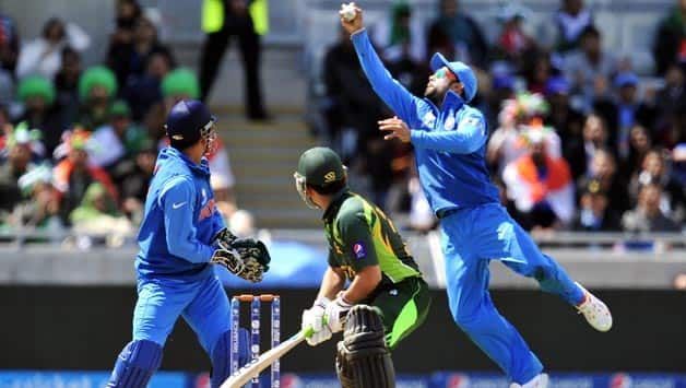 Kohli plucks a blinder to remove Kamran Akmal in the Champions Trophy