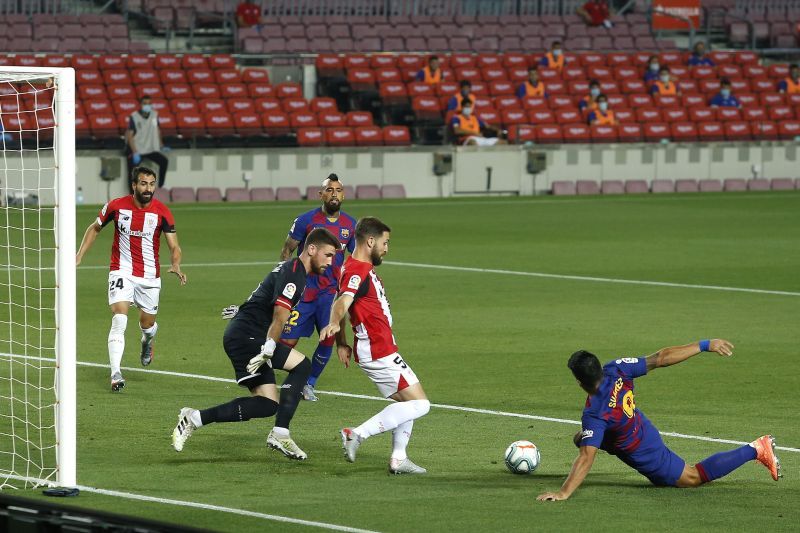 Luis Suarez makes a desperate attempt to score as Bilbao clears its lines