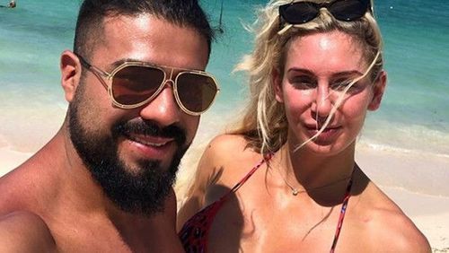 Andrade and Charlotte Flair