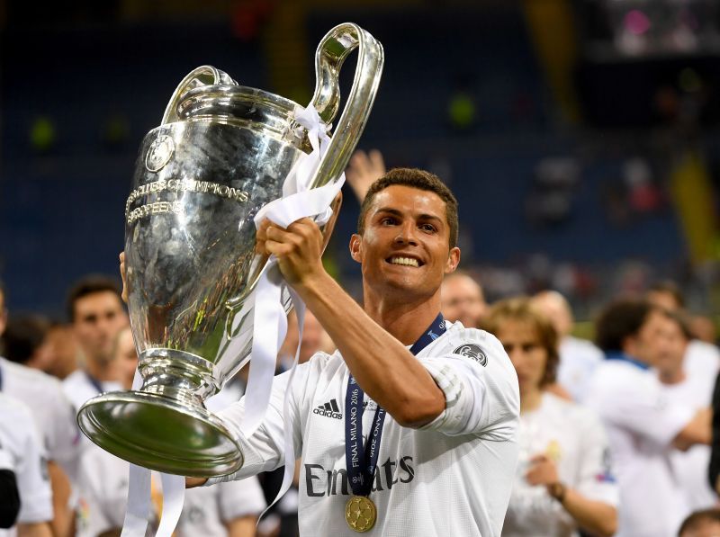 Cristiano Ronaldo celebrates one of his four Champions League trophies won with Real Madrid.