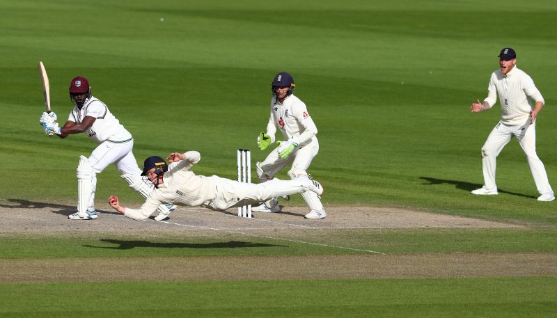 Ollie Pope plunges across to hammer the final nail in Windies' coffin.