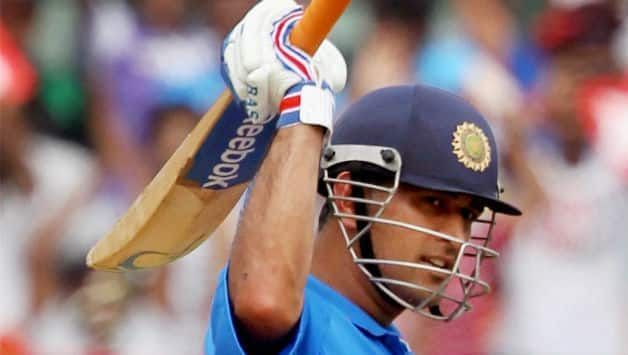 MS Dhoni raises his bat after scoring a hundred against arch-rivals Pakistan