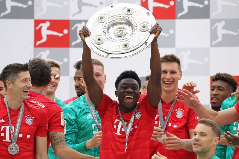 Alphonso Davies celebrates Bayern Munich's Bundesliga triumph with teammates