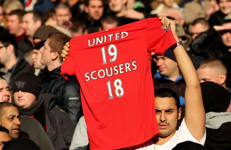 A Manchester United fan shows Liverpool their place. But things have since changed at Anfield.