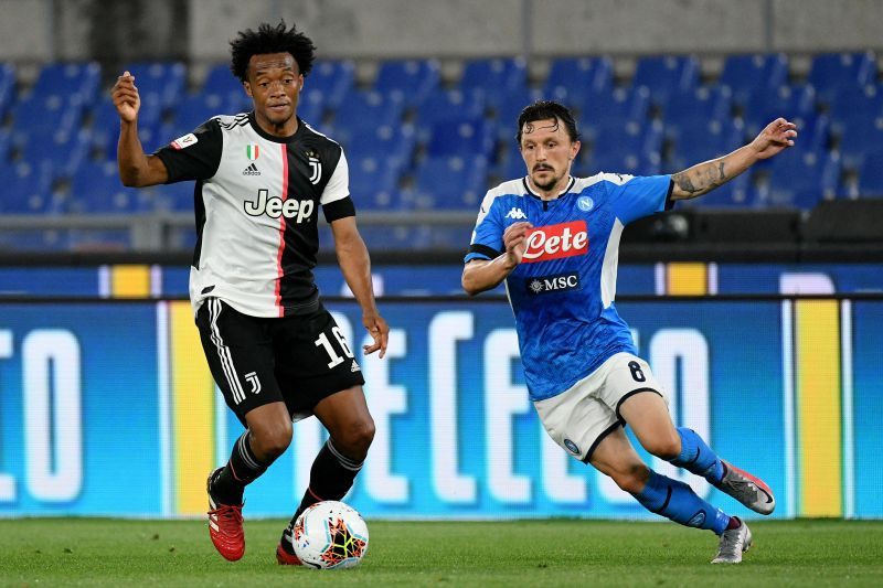 Juan Cuadrado in action against Napoli&#039;s Mario Rui