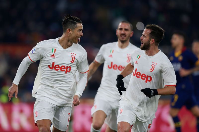 Miralem Pjanic (right) celebrates with Cristiano Ronaldo (left)