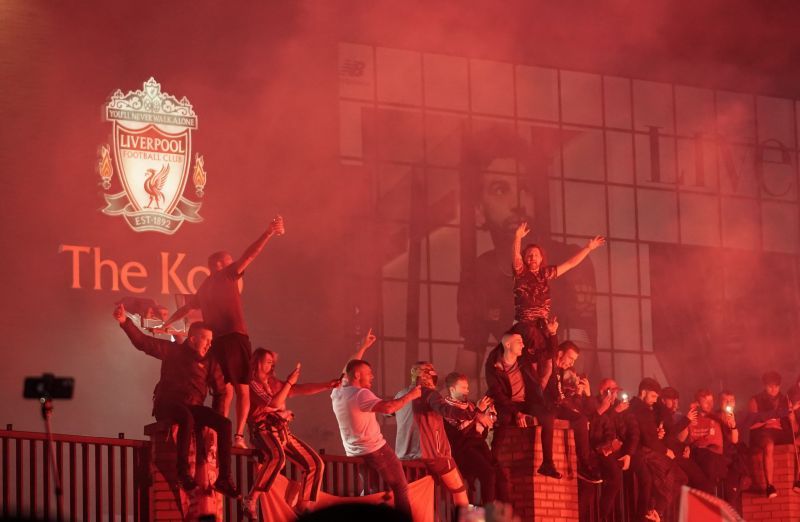 Fans celebrate as Liverpool lift the Premier League title at Anfield