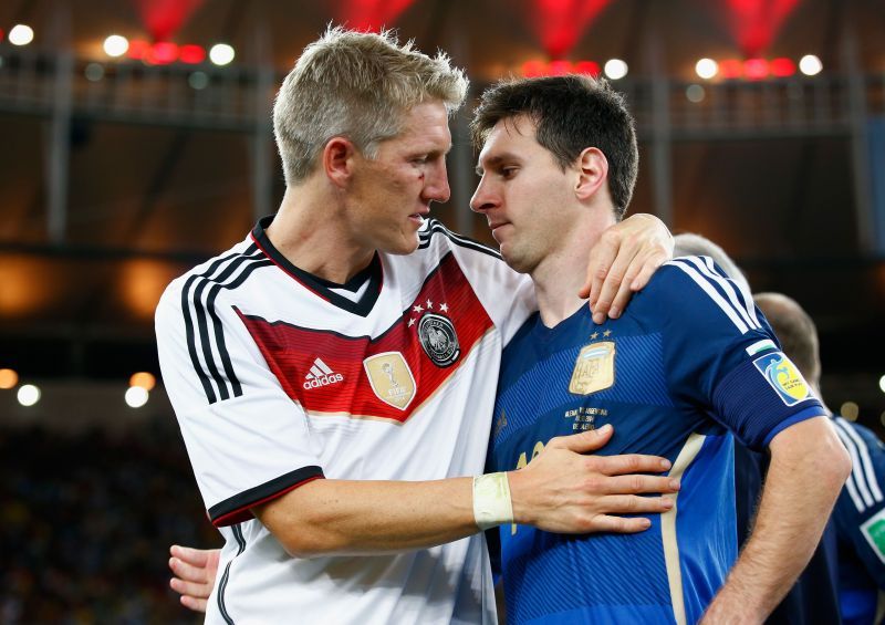 Lionel Messi (right) with Bastian Schweinsteiger after the 2014 World Cup final.