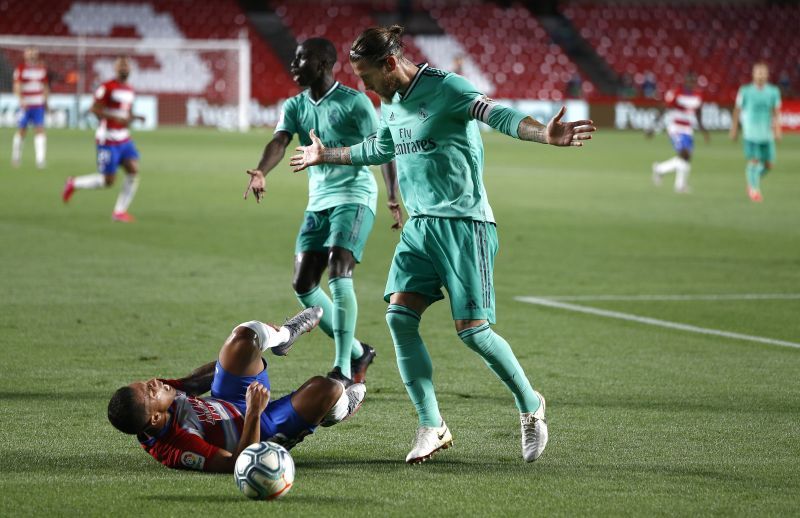 Real Madrid secured a hard-fought 2-1 win over Granada on Monday