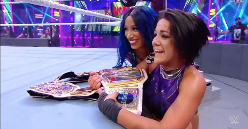 Bayley and Sasha with their titles