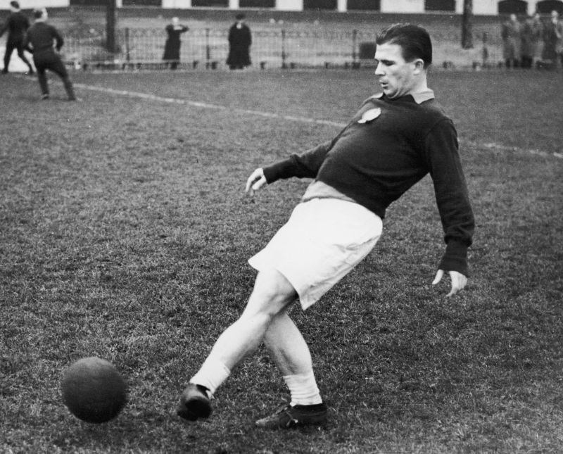 Ferenc Puskas passes the ball.