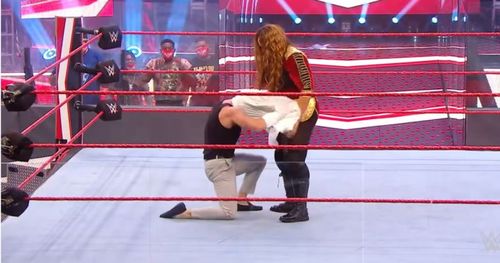 Nia Jax tries to rip Pat Buck's shirt off.