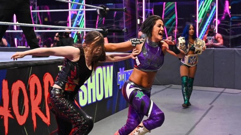 Bayley and Nikki Cross go head to head as Sasha looks on, sporting the SmackDown Women's Title