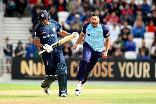 Former England all-rounder Tim Bresnan celebrates taking a wicket.