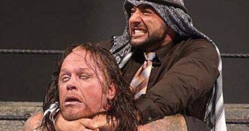 Muhammad Hassan with the Camel Clutch on The Undertaker