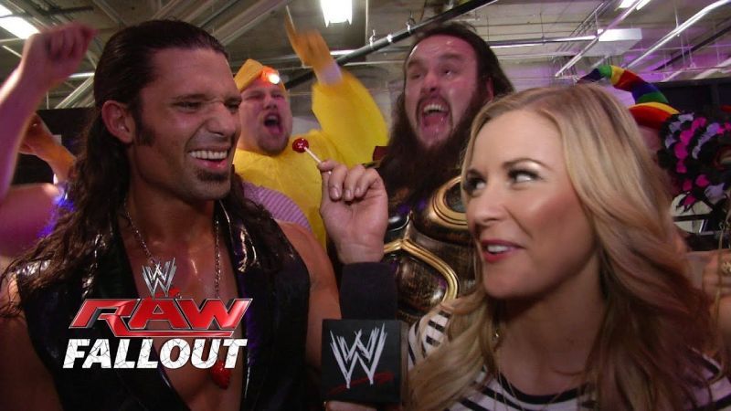 Adam Rose with Braun Strowman behind him