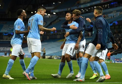 Manchester City players celebrate with Gabriel Jesus after his second-half strike sunk Real Madrid