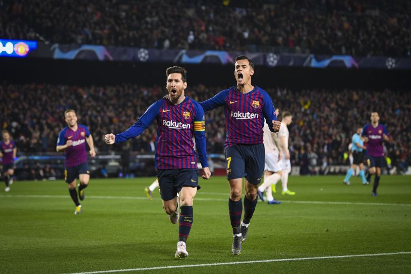 Philippe Coutinho (right) and Lionel Messi (left) celebrating a goal for Barcelona
