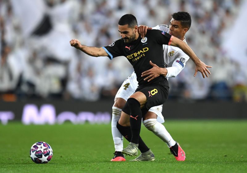 Gundogan battles with Casemiro for the ball