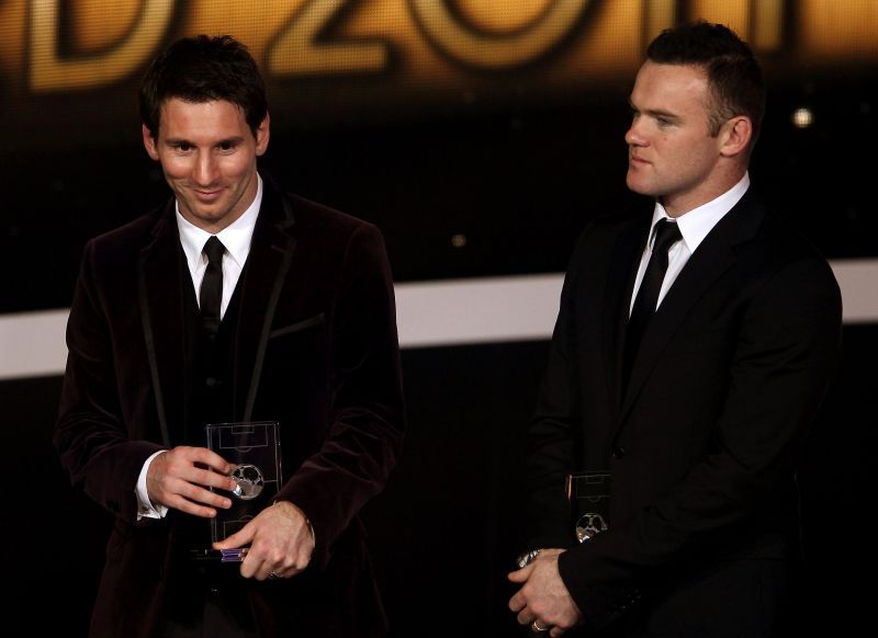 Lionel Messi of Barcelona (L) with Wayne Rooney of Manchester United.