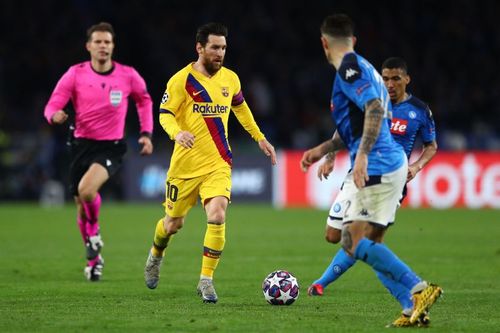 Lionel Messi of Barcelona tracked by Giovanni Di Lorenzo and Allan of Napoli