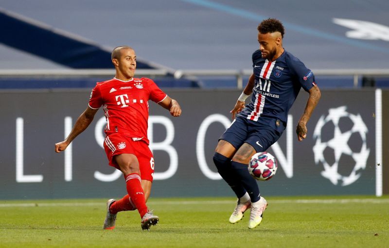 Thiago battles for possession with Neymar