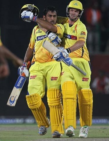 MS Dhoni (left) hit Irfan Pathan for two towering sixes in the final over of the game.