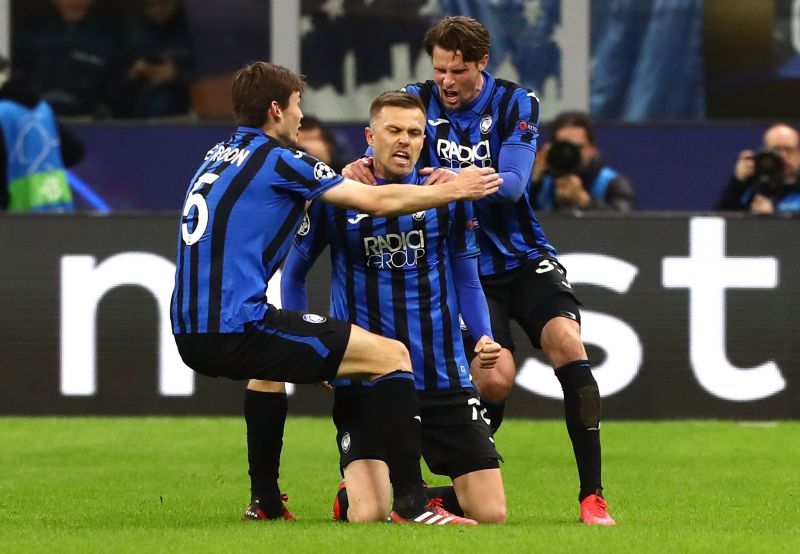 Marten De Roon (left) and Hateboer (right) celebrates with Ilicic (centre) who won't be available for the game