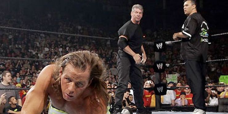 Shane and Vince McMahon ganging-up on Shawn Michaels