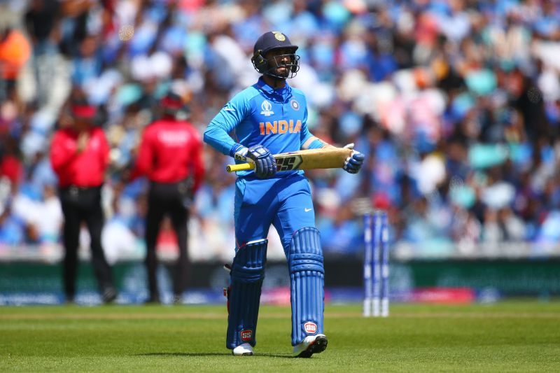 Dinesh Karthik walks back to the pavilion during a World Cup warm-up match.