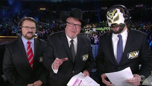 Excalibur with Jim Ross and Tony Schiavone on AEW's broadcast table