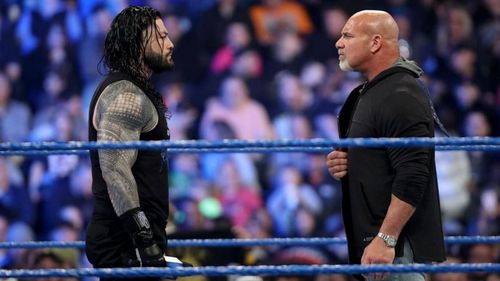 Goldberg and Roman Reigns