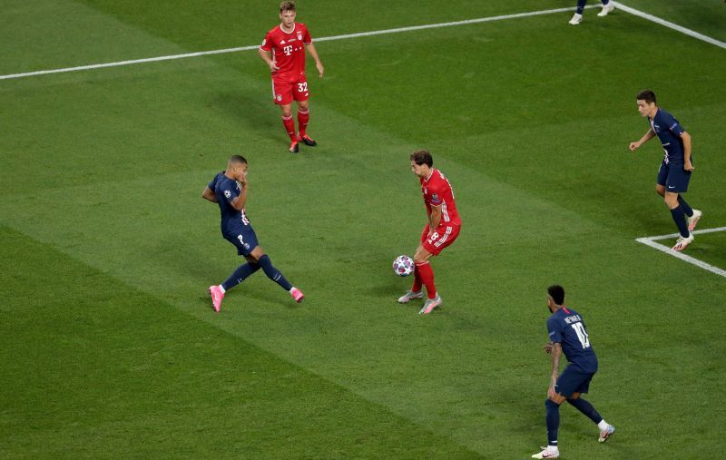  Leon Goretzka of FC Bayern Munich blocks the ball as Kylian Mbappe of Paris Saint-Germain shoots