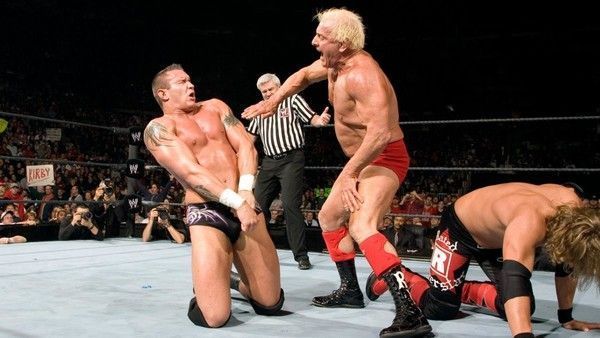 Ric Flair chops Randy Orton's chest