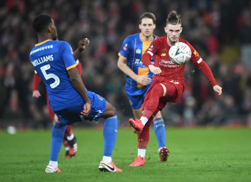 Harvey Elliott of Liverpool is challenged by Ro-Shaun Williams of Shrewsbury Town