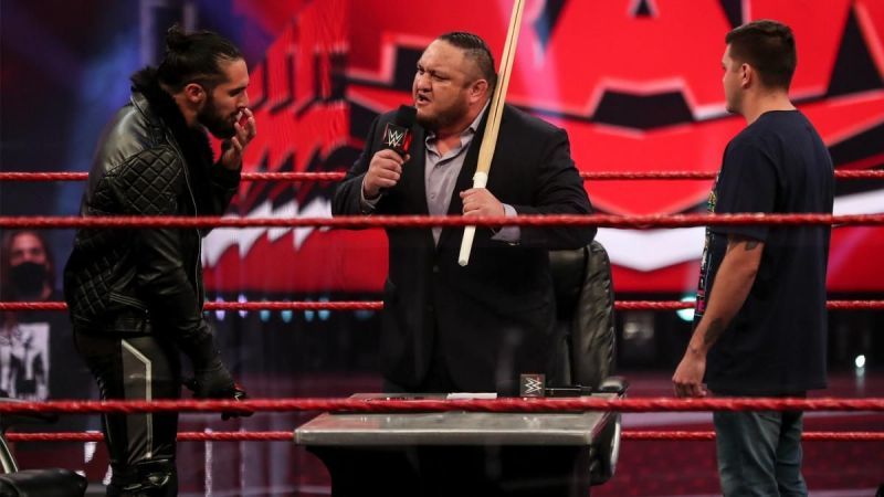 Samoa Joe and Seth Rollins during Dominik's WWE contract signing