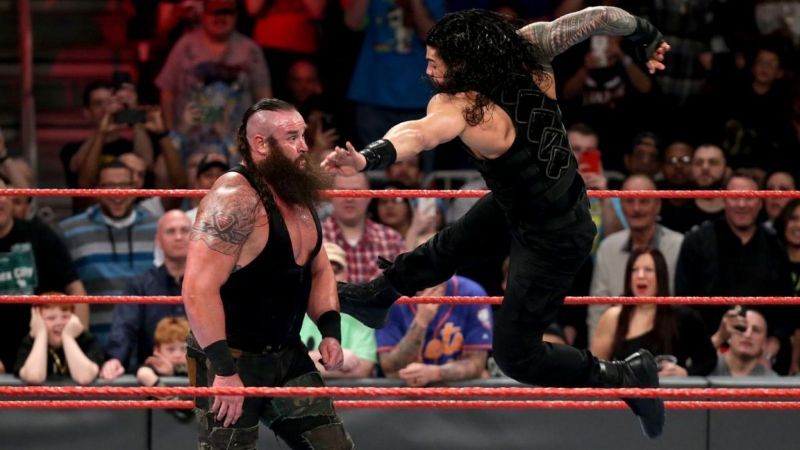 Roman Reigns hits Braun Strowman with the Superman Punch