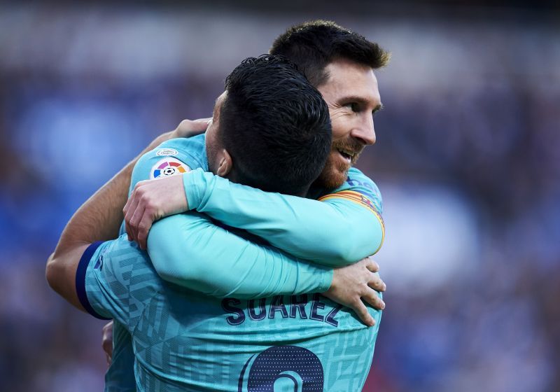 Suarez and Messi celebrating yet another goal