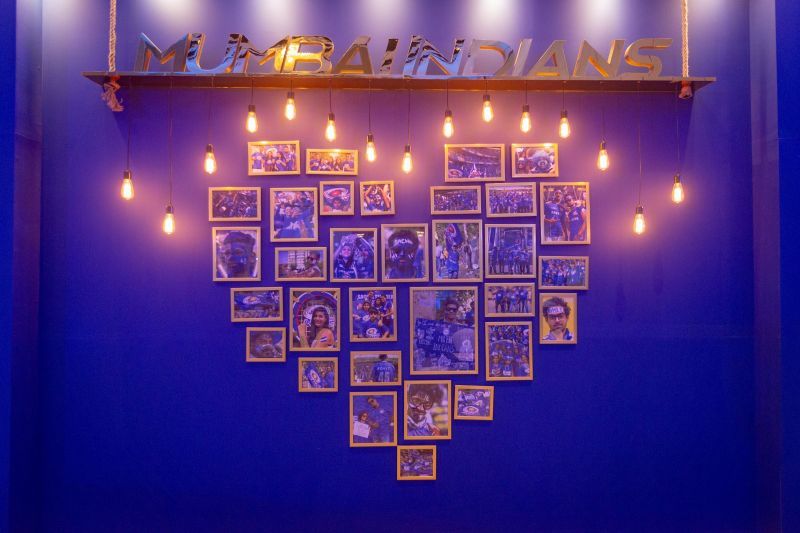 The wall decoration with images of family members of the Mumbai Indians squad