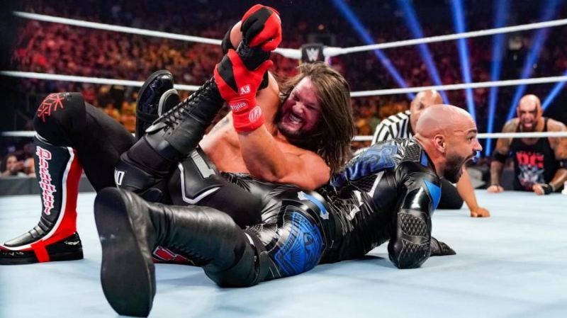 AJ Styles applying the Calf Crusher on Ricochet