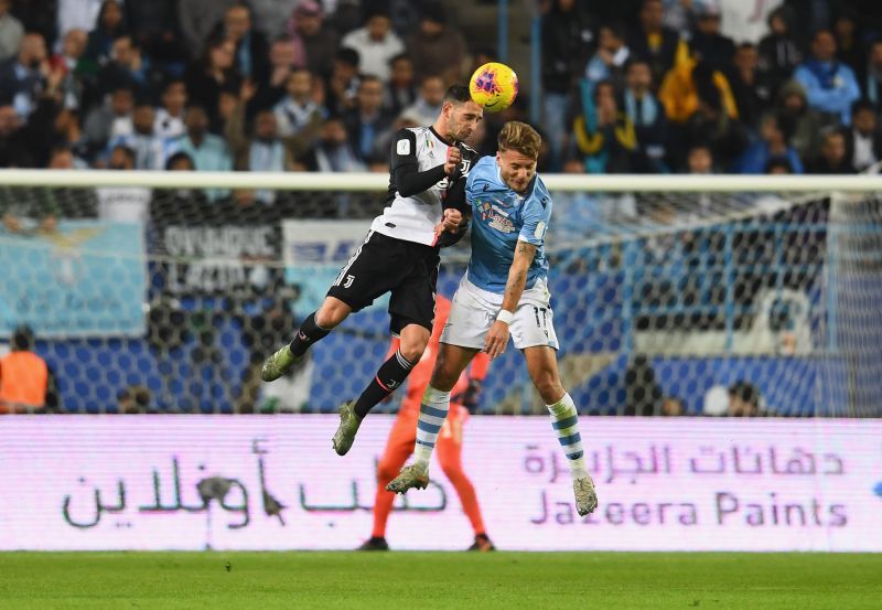 Mattia De Sciglio battles for the ball with Lazio&#039;s Ciro Immobile
