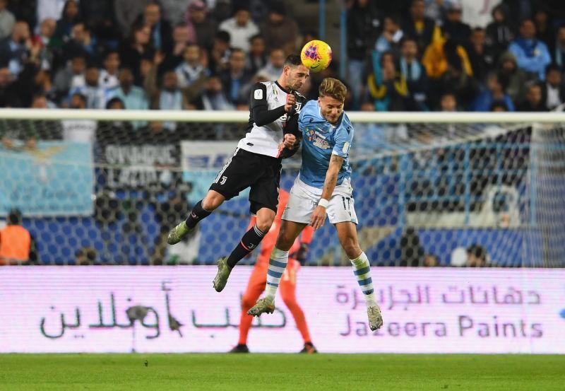 Mattia De Sciglio battles for the ball with Lazio's Ciro Immobile