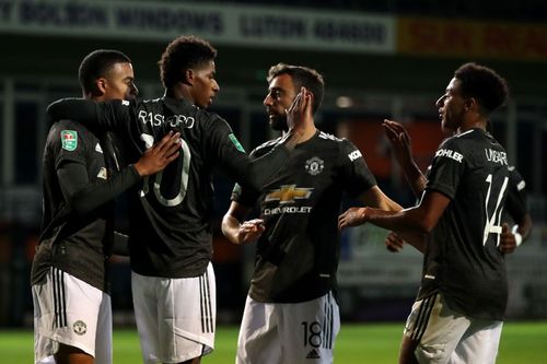 Manchester United celebrate after scoring their second goal of the game