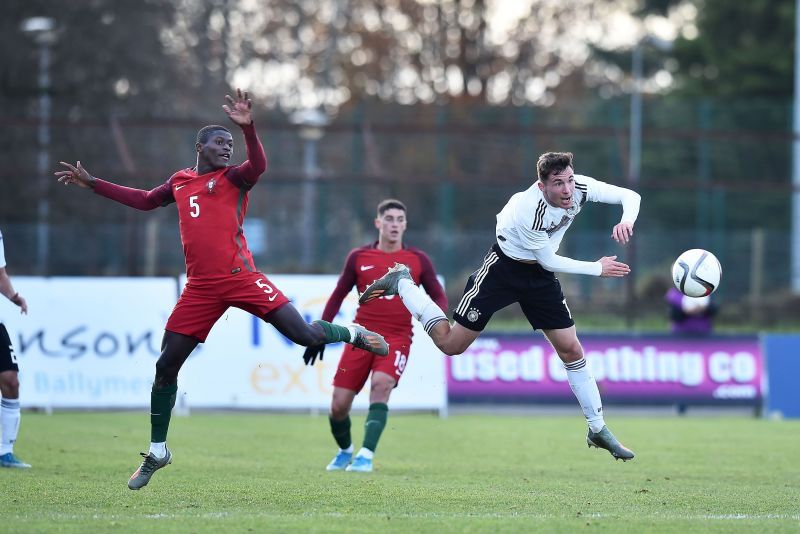 Mendes (left) in action for Portugal&#039;s junior side