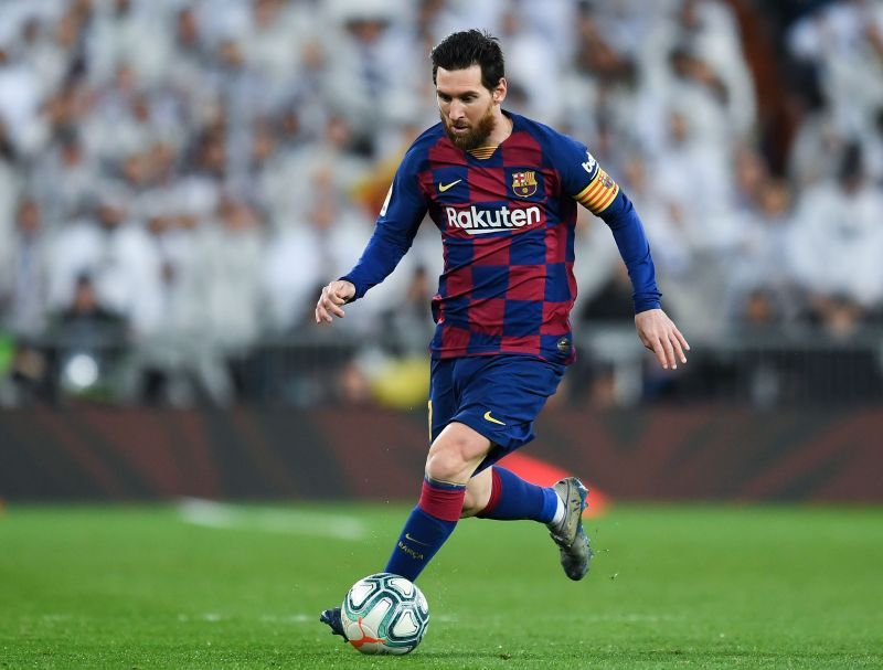 Lionel Messi of FC Barcelona runs with the ball