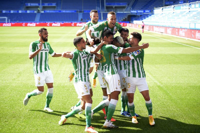 Real Betis players celebrate a goal against Alaves.